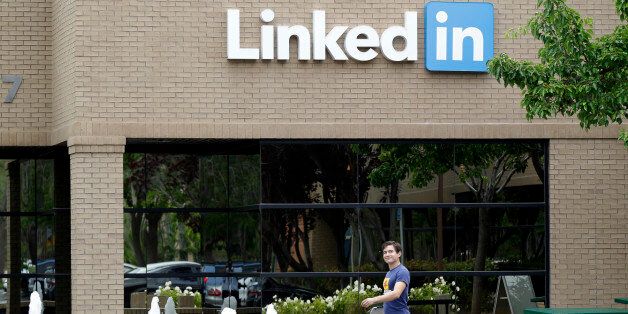 FILE - In this May 8, 2014, file photo, a man walks past the LinkedIn headquarters in Mountain View, Calif. LinkedIn reports financial results Thursday, Aug. 4, 2016. (AP Photo/Marcio Jose Sanchez, File)