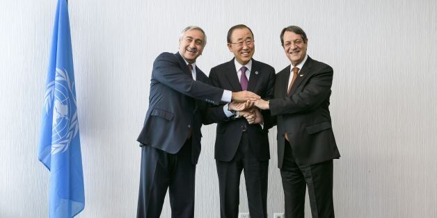 United Nations Secretary-General Ban Ki-Moon (C) poses with Turkish Cypriot leader Mustafa Akinci (L) and Greek Cypriot President Nicos Anastasiades at the start of Cyprus Peace Talks on November 7, 2016 in Mont Pelerin, Western Switzerland where Cyprus' Greek and Turkish speaking communities conduct a key phase of reunification talks, under the aegis of the United Nations. Prospect of Cyprus solution 'within reach'said UN chief Ban Ki-Moon on November 7, 2016. / AFP / POOL / FABRICE COFFRINI
