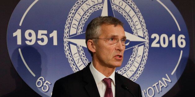 NATO Secretary General Jens Stoltenberg meets journalists with Italian Foreign Minister Paolo Gentiloni during a