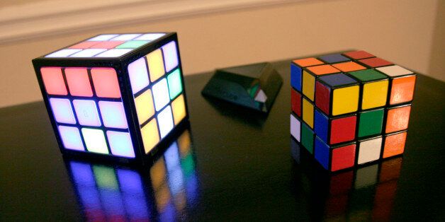 In this photo made Tuesday, Sept. 22, 2009, Techno Source's new Rubik's TouchCube puzzle, left, is shown next to an original Rubik's cube in Decatur, Ga. (AP Photo/Ron Harris)