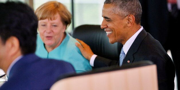 German Chancellor Angela Merkel (C) and U.S. President Barack Obama (R) chat during the second working session during the 2016 Ise-Shima G7 Summit in Shima, Japan May 26, 2016. REUTERS/Carlos Barria