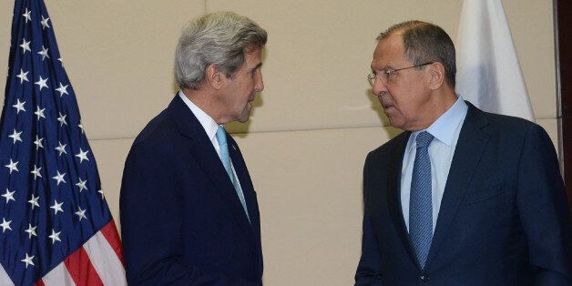US Secretary of State John Kerry (L) speaks with Russia's Foreign Minister Sergey Lavrov as they meet on the sidelines of the Association of Southeast Asian Nations (ASEAN) annual ministerial meeting in Vientiane on July 26, 2016.Southeast Asian nations on July 25 ducked direct criticism of Beijing over its claims to the South China Sea, in a diluted statement produced after days of disagreement that gives the superpower a diplomatic victory. / AFP / HOANG DINH NAM (Photo credit should read HOANG DINH NAM/AFP/Getty Images)
