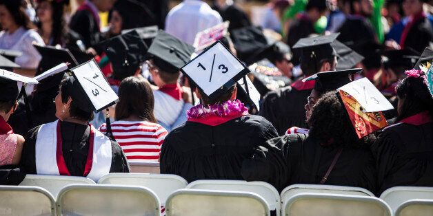 STANFORD, CA - JUNE 12: Graduating students wear signs on their caps, a reference to rape statistics, during the 125th Stanford University commencement ceremony on June 12, 2016 in Stanford, California. The university holds its commencement ceremony amid an on-campus rape case and its controversial sentencing. (Photo by Ramin Talaie/Getty Images)