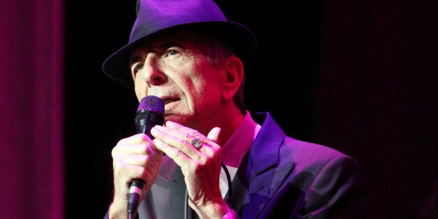 CORRECTS DATE OF STATEMENT- In this March 22, 2013 file photo, Leonard Cohen performs on the Old Ideas World Tour, at The Fabulous Fox Theatre in Atlanta. Cohen, the gravelly-voiced Canadian singer-songwriter of hits like âHallelujah,â