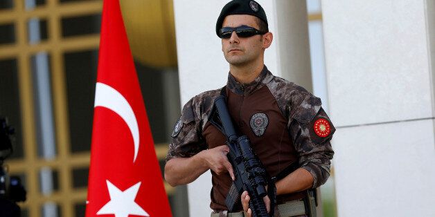 FILE PHOTO - A Turkish special forces police officer guards the entrance of the Presidential Palace in Ankara, Turkey, August 5, 2016. REUTERS/Umit Bektas/File Photo
