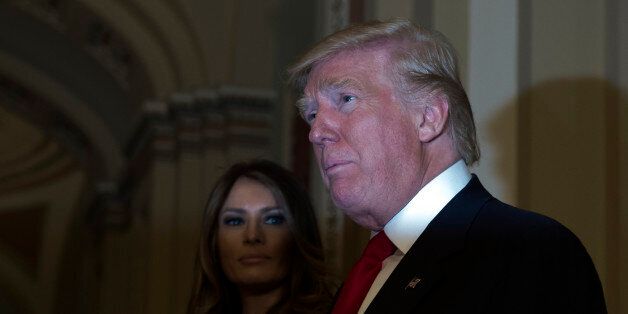 President-elect Donald Trump, accompanied by his wife Melania, speaks to the media on Capitol Hill in Washington, Thursday, Nov. 10, 2016, following a meeting with Senate Majority Leader Mitch McConnell of Ky. (AP Photo/Molly Riley)