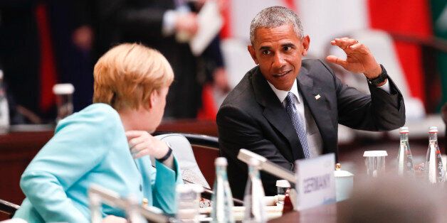 HANGZHOU, CHINA - SEPTEMBER 04: German chancellor Angela Merkel (L) speaks with US President Barack Obama during the opening ceremony of the G20 Leaders Summit at the Hangzhou International Expo Center on September 4, 2016 in Hangzhou, China. World leaders are gathering in Hangzhou for the 11th G20 Leaders Summit from September 4 to 5. (Photo by Du Yang/CNSPHOTO/VCG/VCG via Getty Images)