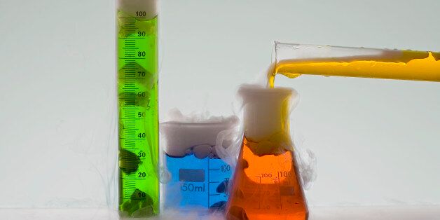 Beakers and cylinders with colorful liquids