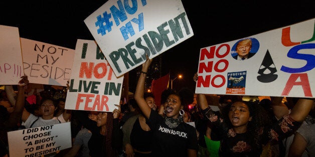 MIAMI, FL - NOVEMBER 11: Protesters march against President-elect Donald Trump on November 11, 2016 in Miami, Florida. (Photo by Jason Koerner/FilmMagic)