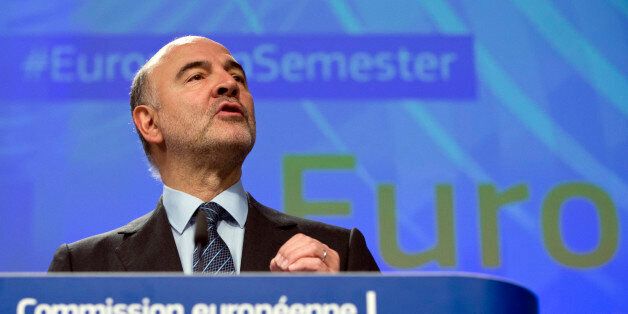 European Commissioner for Economic and Financial Affairs Pierre Moscovici speaks during a media conference at EU headquarters in Brussels on Wednesday, Nov. 16, 2016. The European Union is warning eight countries including Italy, Portugal and Spain that their budget plans for next year might not comply with the rules governing the euro single currency. (AP Photo/Virginia Mayo)