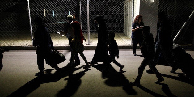 Refugees walk inside the Kokkinotrimithia refugee camp outside Nicosia, Cyprus, November 10, 2016. REUTERS/Yiannis Kourtoglou