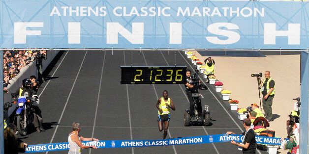 Kenya's Raymond Bett approaches the finishing line to win the Athens Classic Marathon at the Panathinaiko Stadium in Athens on Sunday, Oct. 31, 2010. The race coincides with the 2,500th anniversary of the battle of Marathon, where Athenians and their allies repelled an invading army of Persians. A messenger ran to Athens after the battle and died after announcing the victory. (AP Photo/Dimitris Hatzimoisis)