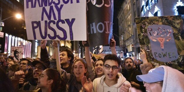 Protestors shout slogans during in a demonstration on 5th Avenue across from Trump Tower on November 9, 2016 in New York, after Donald Trump was elected as the next president of the US. / AFP / MANDEL NGAN (Photo credit should read MANDEL NGAN/AFP/Getty Images)