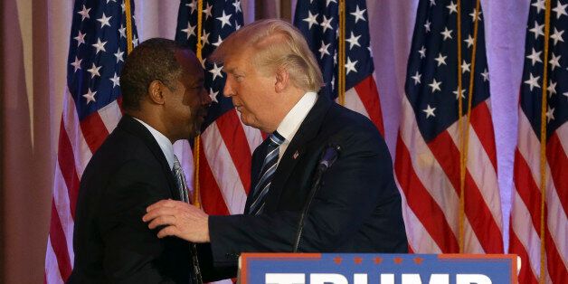 Former Republican presidential candidate Ben Carson, left, embraces Republican presidential candidate Donald Trump, after announcing he will endorse Trump during a news conference at the Mar-A-Lago Club, Friday, March 11, 2016, in Palm Beach, Fla. (AP Photo/Lynne Sladky)
