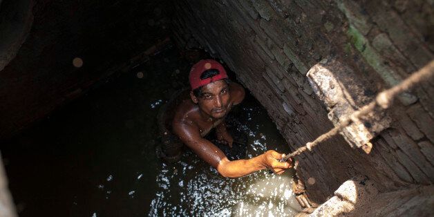 DHAKA, BANGLADESH - APRIL 30: Jashim 23 , a sewer cleaner of Dhaka City Corporation cleaning out the city's sewers on April 30, 2016 in Old Dhaka, Bangladesh. Despite a rise in the number of deaths of manhole workers every year, workers regularly go into the manholes without any protective gear.PHOTOGRAPH BY Zakir Chowdhury / Barcroft ImagesLondon-T:+44 207 033 1031 E:hello@barcroftmedia.com -New York-T:+1 212 796 2458 E:hello@barcroftusa.com -New Delhi-T:+91 11 4053 2429 E:hello@barcroftindia.com www.barcroftimages.com (Photo credit should read Zakir Chowdhury/Barcroft Images / Barcroft Media via Getty Images)