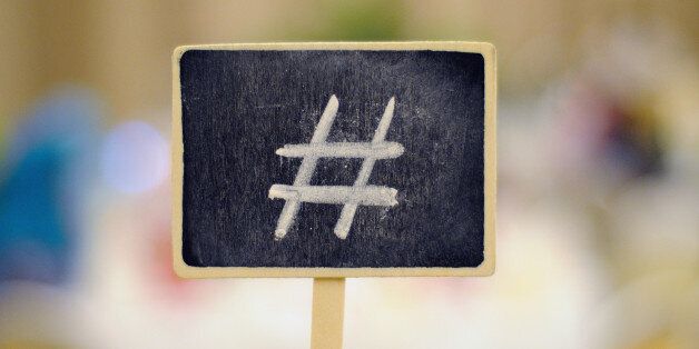 Hashtag symbol at small blackboard writen using white chalk.