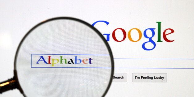 A Google search page is seen through a magnifying glass in this photo illustration taken in Berlin, August 11, 2015. A U.S. Jury handed Google a major victory May 26, 2016 in a long-running copyright battle with Oracle Corp over Android software to run most of the world's smartphones. REUTERS/Pawel Kopczynski/Files