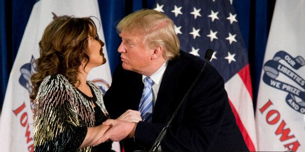 Former Alaska Gov. Sarah Palin, left, endorses Republican presidential candidate Donald Trump during a rally at the Iowa State University, Tuesday, Jan. 19, 2016, in Ames, Iowa. (AP Photo/Mary Altaffer)