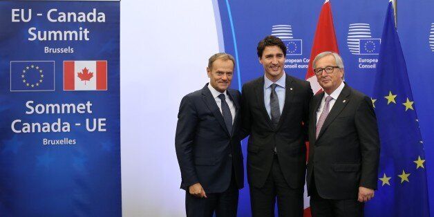 BRUSSELS, BELGIUM - OCTOBER 30: European Council President Donald Tusk (L), Canadian Prime Minister Justin Trudeau and European Commission President Jean-Claude Juncker (R) pose as they attend the EU - Canada summit at the European Union headquarters in Brussels, Belgium, on October 30, 2016. EU-Canada summit to sign the agreement on the Comprehensive Economic and Trade Agreement (CETA), a trade deal between the EU and Canada, in Brussels, Belgium, on October 30, 2016. (Photo by Dursun Aydemir/Anadolu Agency/Getty Images)