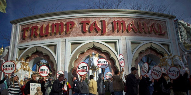 FILE PHOTO: Union members from UNITE HERE Local 54 rally outside the Trump Taj Mahal Casino in Atlantic City, New Jersey October 24, 2014. REUTERS/Mark Makela/File Photo