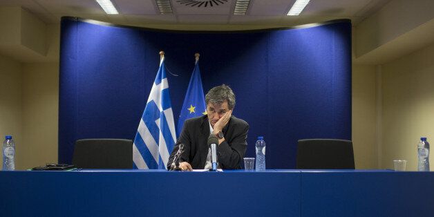 Euclid Tsakalotos, Greece's finance minister, looks on following a news conference after a Eurogroup meeting in Brussels, Belgium, on Monday, May 9, 2016. The euro area and the International Monetary Fund will assess whether Greek Prime Minister Alexis Tsipras has made enough budget-tightening commitments to gain another disbursement of emergency loans. Photographer: Jasper Juinen/Bloomberg via Getty Images