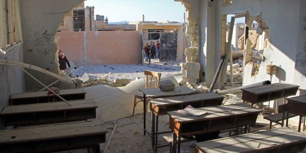 TOPSHOT - A general view shows a damaged classroom at a school after it was hit in an air strike in the village of Hass, in the south of Syria's rebel-held Idlib province on October 26, 2016. / AFP / Omar haj kadour (Photo credit should read OMAR HAJ KADOUR/AFP/Getty Images)