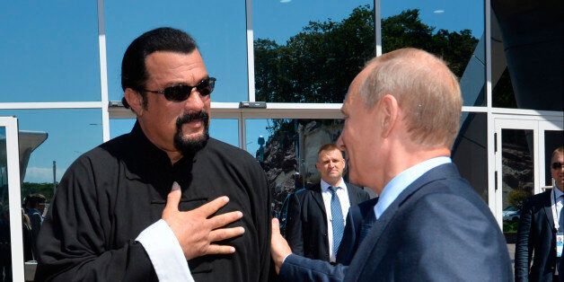 FILE - In this Sept. 4, 2015, file photo, Russian President Vladimir Putin, right, speaks with U.S. actor Steven Seagal in the Russian Far Eastern port of Vladivostok. Russian President Vladimir Putin has awarded Russian citizenship to action film actor Steven Seagal. Putin has awarded Russian citizenship to action film actor Seagal. The 64-year-old Seagal has been a regular visitor to Russia in recent years and has accompanied Putin to several martial arts events, as well as vocally defending the Russian leader's policies. (Alexei Druzhinin/RIA-Novosti, Kremlin Pool Photo via AP, File)