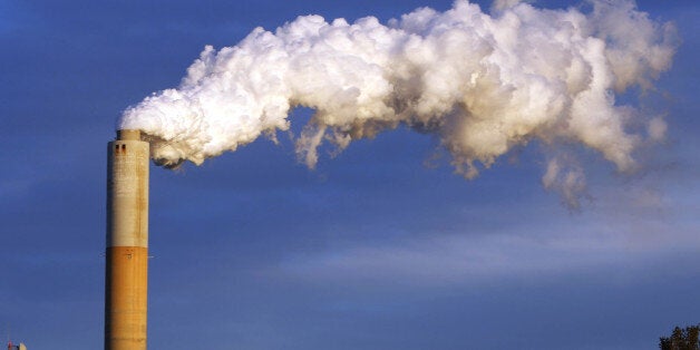 FILE - In this Jan. 20, 2015 file photo, steam billows from the chimney or a coal-fired Merrimack Station in Bow, N.H. USA. The Paris Agreement on climate change comes into force Friday Nov. 4, 2016, after a year of remarkable success in international efforts to slash man-made emissions of carbon dioxide and other global warming gases. (AP Photo/Jim Cole, FILE)