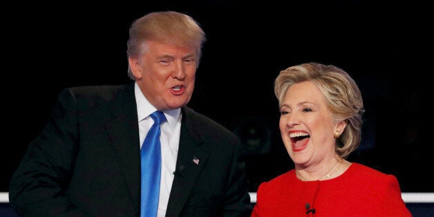 Republican U.S. presidential nominee Donald Trump shakes hands with Democratic U.S. presidential nominee Hillary Clinton at the conclusion of their first presidential debate at Hofstra University in Hempstead, New York, U.S., September 26, 2016. REUTERS/Mike Segar/File Photo