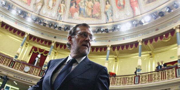 Spain's acting Prime Minister Mariano Rajoy looks back as he leaves his seat after the investiture debate at the Parliament in Madrid, Spain October 27, 2016. REUTERS/Sergio Perez