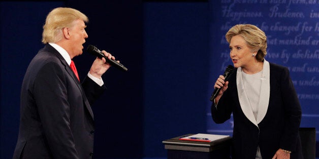 FILE - In this Sunday, Oct. 9, 2016, file photo, Republican presidential nominee Donald Trump and Democratic presidential nominee Hillary Clinton speak during the second presidential debate at Washington University in St. Louis. Trump gets outsized attention for what heâs tweeting and retweeting on a near-daily basis. But Clinton has a formidable digital media army, her own app and a rapid response team ready to blast out shareable soundbites from convention speeches, photos, videos and even temporary location-specific Snapchat filters mocking Republicans. (AP Photo/John Locher, File)