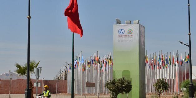 A Moroccan labourer drives a scooter at the site of the COP22 international climate conference in Marrakesh on October 31, 2016, a week before the start of the talks.The organisation committee of the COP22 announced on November 2, 2016 that the site of the event which consists of 55 tents is nearly ready, / AFP / STRINGER / TO GO WITH AFP STORY BY JALAL AL-MAKHFI (Photo credit should read STRINGER/AFP/Getty Images)