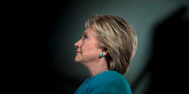 TOPSHOT - US Democratic presidential nominee Hillary Clinton waits to speak during a rally at the Armory November 6, 2016 in Manchester, New Hampshire. / AFP / Brendan Smialowski (Photo credit should read BRENDAN SMIALOWSKI/AFP/Getty Images)