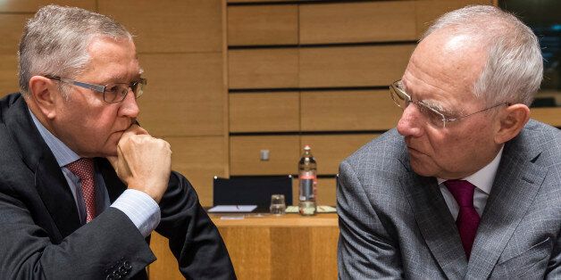 Germany's Finance Minister Wolfgang Schauble, right, talks with European Stability Mechanism Managing Director Klaus Regling during an EU finance ministers meeting at the EU Council in Luxembourg on Tuesday, Oct. 11, 2016. (AP Photo/Geert Vanden Wijngaert)
