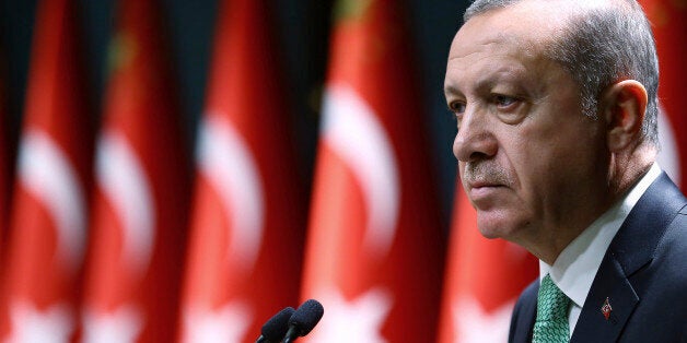 Turkey's President Recep Tayyip Erdogan addresses a meeting in Ankara, Turkey, Thursday, Oct. 20, 2016. Turkish jets have struck the U.S.-backed Syrian Kurdish militia north of the embattled city of Aleppo, killing as many as 200 militia members, Turkey's state-run news agency reported Thursday. The Anadolu Agency, quoting military officials, said the raids were carried out late Wednesday night, attacking 18 targets in the Maarraat Umm Hawsh region in northern Syria.(Kayhan Ozer, Presidential Press Service, Pool photo via AP)