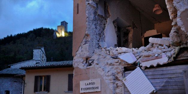 A damaged building in Visso, central Italy, Thursday, Oct 27, 2016, following an earthquake that destroyed part of the neighborhood. A pair of strong aftershocks shook central Italy late Wednesday, crumbling churches and buildings, knocking out power and sending panicked residents into the rain-drenched streets just two months after a powerful earthquake killed nearly 300 people. (AP Photo/Sandro Perozzi)