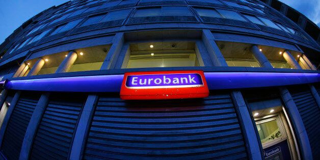 View of a Eurobank branch in central Athens March 11, 2015. Greece's Eurobank reported a jump in fourth-quarter losses on Wednesday as provisions for impaired credit weighed on its bottom line, while the pace of new bad debt formation was steady around third-quarter levels. REUTERS/Yannis Behrakis (GREECE - Tags: POLITICS BUSINESS)