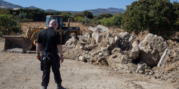 KOS, GREECE - OCTOBER 06: Detective Inspector Jon Cousins of the South Yorkshire Police walks past rubble at a new second search site approximately 1km from the farmhouse search site of missing toddler Ben Needham on October 6, 2016 in Kos, Greece. The 21 month old toddler from Sheffield vanished on the Greek island in July of 1991. A 19-strong team of police officers, forensic specialists and an archaeologist have been searching an olive grove next to the farm for the past eleven days and have now begun work on a second site, where rubble from the farmhouse was deposited in the days after Ben Needham's disappearance. (Photo by Chris McGrath/Getty Images)