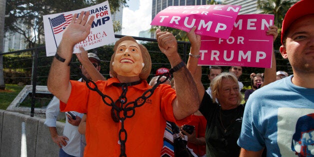 Supporters of Republican presidential candidate Donald Trump listen as he speaks during a campaign rally, Wednesday, Nov. 2, 2016, in Miami. (AP Photo/ Evan Vucci)