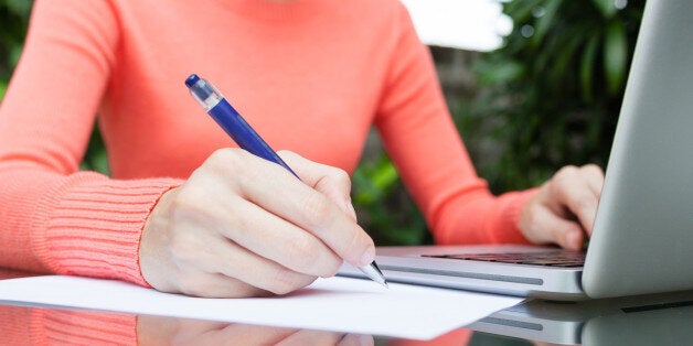 Female making notes.