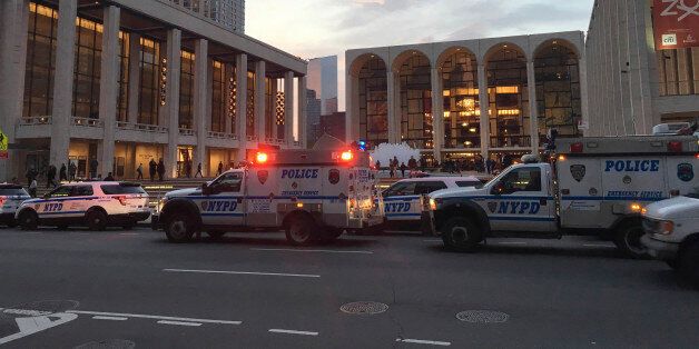 Police respond to New York's Metropolitan Opera which halted a performance after someone sprinkled an unknown powder into the orchestra pit, Saturday, Oct. 29, 2016. Met spokesman Sam Neuman said the afternoon's performance of