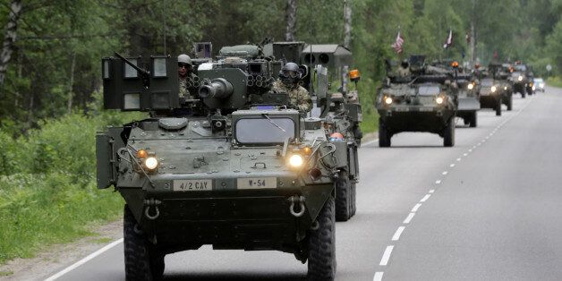 U.S. troops drive during tactical road march Dragoon Ride II near Daugavpils, Latvia, June 6, 2016. REUTERS/Ints Kalnins