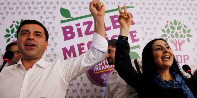 File Photo: Co-chairs of the pro-Kurdish Peoples' Democratic Party (HDP), Selahattin Demirtas and Figen Yuksekdag celebrate election results during a news conference in Istanbul, Turkey, June 7, 2015. REUTERS/Murad Sezer/File Photo