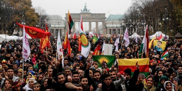 Thousands of Kurdish protesters demanding the end of the ban of the Kurdistan Workers' Party, commonly known as PKK, in Berlin, Germany, Saturday, Nov. 16, 2013. With the demonstration the protesters mark the ban of the PKK in Germany 20 years ago. (AP Photo/Markus Schreiber)