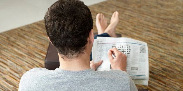 Man Doing Crossword Puzzle