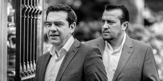 Alexis Tsipras, Greece's Prime Minister, left, and Nikos Pappas, Greece's Minister of State, right, outside the Greek Presidential Palace after meeting with party leaders in Athens, Greece, on July 6, 2015, before the critical EU Summit in Brussels.