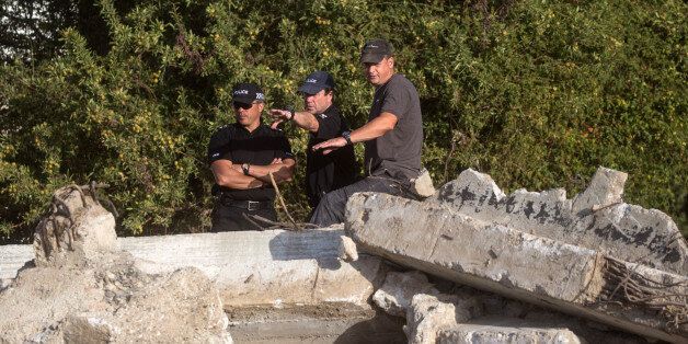KOS, GREECE - OCTOBER 08: South Yorkshire Police officers look over the new second search site approximately 1km from the farmhouse search site of missing toddler Ben Needham on October 8, 2016 in Kos, Greece. The 21 month old toddler from Sheffield vanished on the Greek island in July of 1991. A 19-strong team of police officers, forensic specialists and an archaeologist have been searching an olive grove next to the farm for the past twelve days and have now begun work on a second site, where rubble from the farmhouse was deposited in the days after Ben Needham's disappearance. (Photo by Chris McGrath/Getty Images)