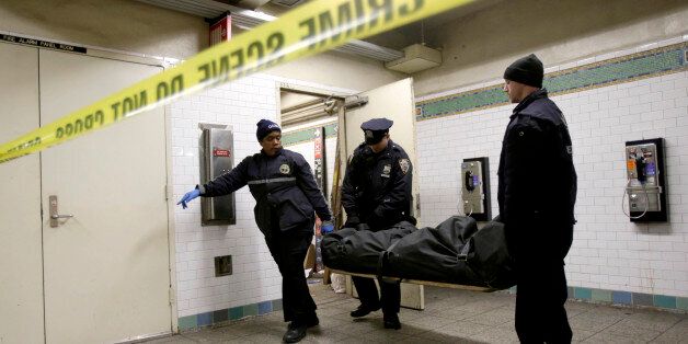 A police officer and medical examiner personnel carry a body out of a Times Square subway station in New York, Tuesday, Jan. 22, 2013. Authorities say a man has died after he was struck by a subway train in Times Square. Witnesses told police that the man jumped into the trainâs path. Transit spokeswoman Judie Glave says the incident around 10 a.m. Tuesday involved a No. 2 train. (AP Photo/Seth Wenig)