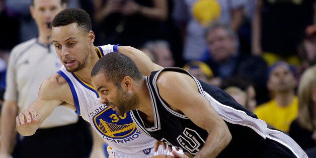San Antonio Spurs' Tony Parker, right, tries to dribble around Golden State Warriors' Stephen Curry during the first half of an NBA basketball game Thursday, April 7, 2016, in Oakland, Calif. (AP Photo/Marcio Jose Sanchez)