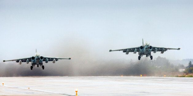 In this photo provided by the Russian Defense Ministry Press Service a pair of Russian Su-25 ground attack jets take off at Hemeimeem air base in Syria on Wednesday, March 16, 2016. Russia's defense ministry says another group of its aircraft has left the Russian air base in Syria and is returning home. Wednesday's announcement comes two days after President Vladimir Putin ordered Russian military to withdraw most of its fighting forces from Syria, signaling an end to Russia's five-and-a-half month air campaign. (Vadim Grishankin/Russian Defense Ministry Press Service via AP)